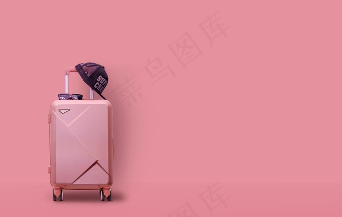 粉色背景潮流旅行箱图片