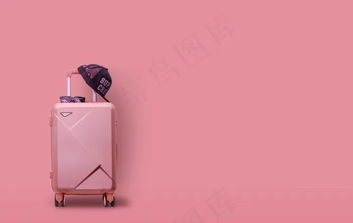 粉色背景潮流旅行箱图片