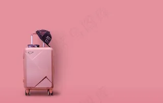 粉色背景潮流旅行箱图片