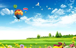 蓝天白云绿草地花背景图片