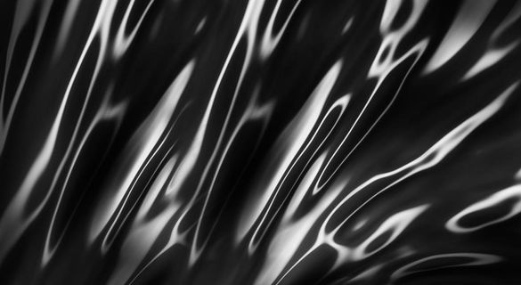 黑色绸缎液体合成背景图片