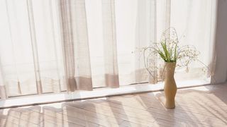 米色落地窗阳台花瓶海报背景
