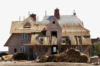 路边搭建的茅草房免抠