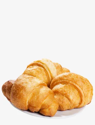 白色盘子里的牛角包烘焙糕点免抠