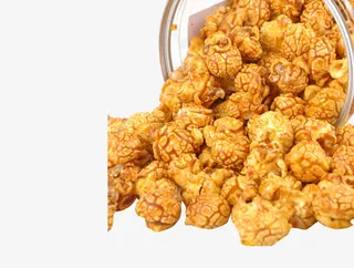 玻璃罐中散落出来的球形爆米花免抠