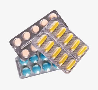 黄蓝粉红色治愈包装盒里的西药片免抠