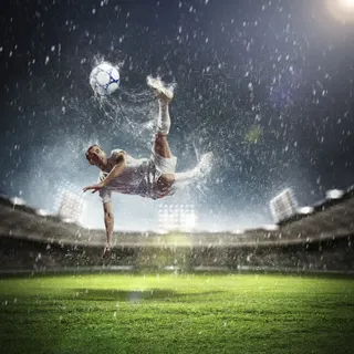 足球运动员下雨足球场高清背景图片 足球运动员下雨足球场高清背景图片