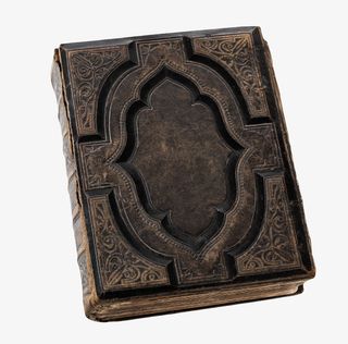 深棕色雕刻线条的旧书古代器物实免抠