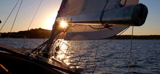 夕阳船帆海报背景高清