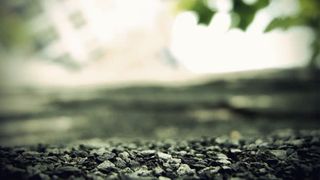 黑色石子地面海报背景