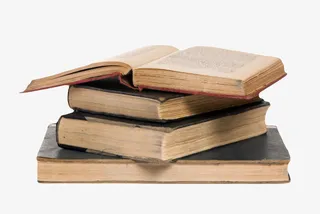 黑色残旧翻开堆起来的书实物免抠