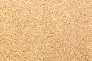 浅黄色木屑纸板背景