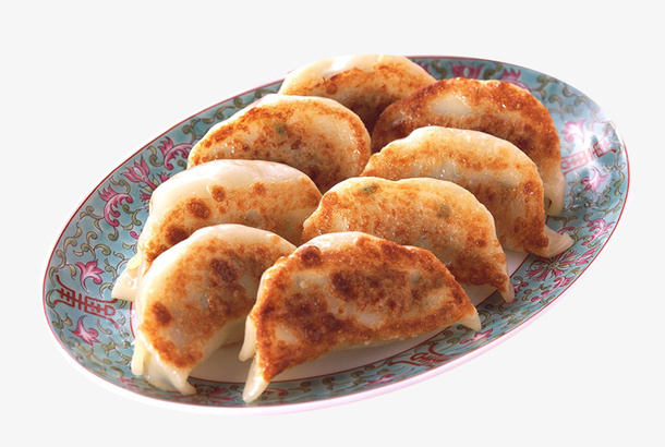 盘子里的肉馅煎饺锅贴免抠