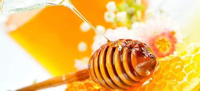 摄影黄底蜂蜜糖果背景高清