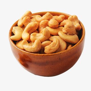 黄色唯美装饰碗装腰果设计图免抠