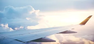 蓝天白云机翼海报背景高清