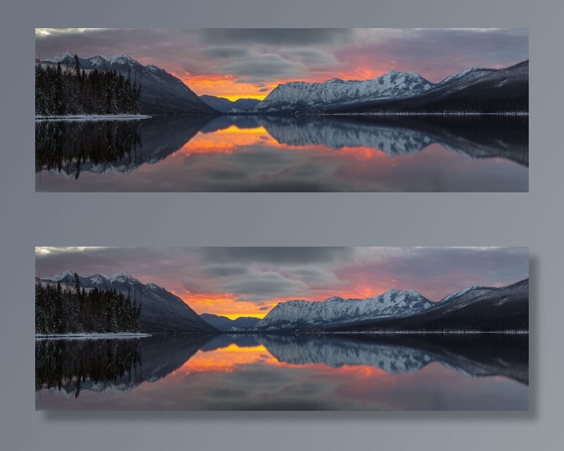 日落时湖中山脉的倒影