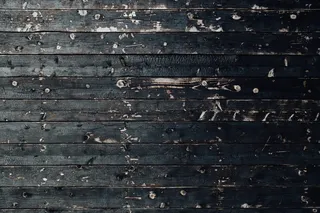 黑色实木拼花地板隔断特写照片