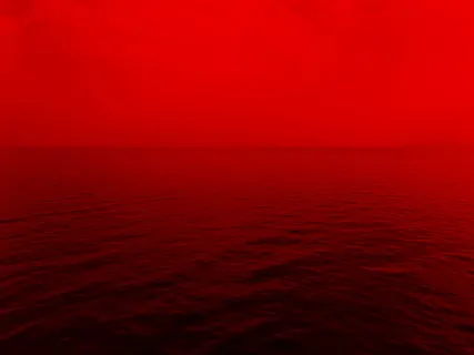 红色灯光下的海洋照片