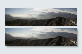 白色卡车行驶在离山很远的路上