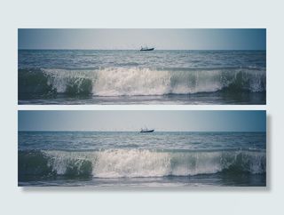 白天，白色和蓝色天空下，绿色海洋上的黑色船只