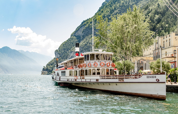 White Ship On Body Of Water Beside Mountain