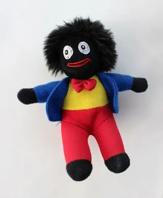 在白色背景上隔离的Golliwog玩具