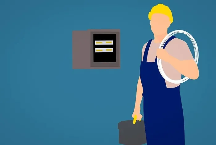 电工在工作现场配备设备和配电盘的图示。