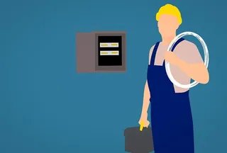 电工在工作现场配备设备和配电盘的图示。