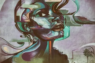 肖尔迪奇的墙上拍摄的充满活力的街头艺术肖像