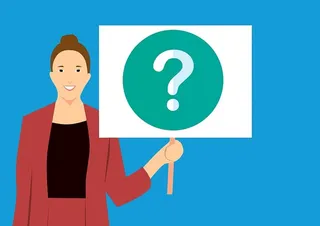 商业女性示意图，带有提示提问的标志