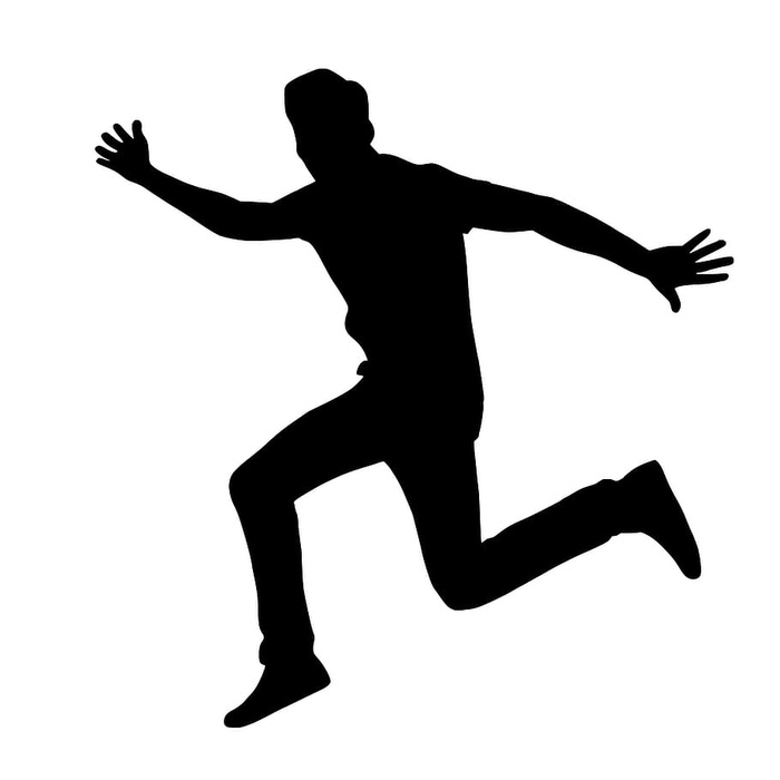 跳跃兴奋的男人的剪影。