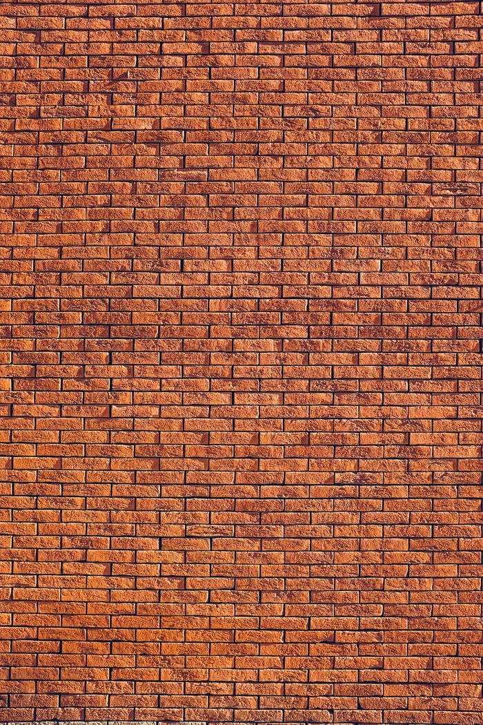 棕色墙面包层，棕色混凝土砖，砖，墙，图案，阳光，阴影，纹理