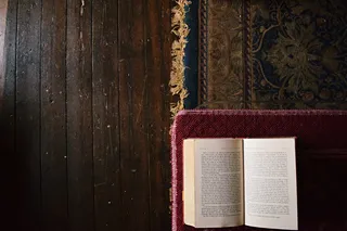 white book on maroon mat