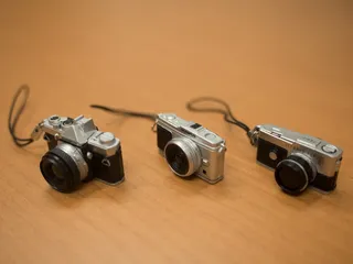 相机，模型，表带，奥林巴斯，室内，摄影主题，木质材料，摄影棚拍摄