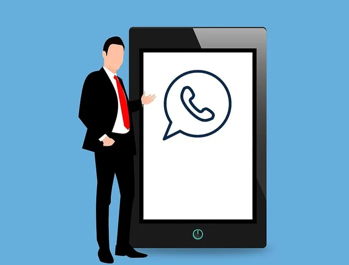WhatsApp社交媒体应用在移动平板电脑上，带有站立的商人插图。