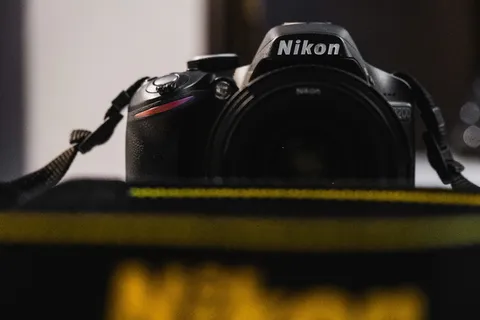 相机，电子产品，表带，数码相机，相机镜头，镜头盖，标志，商标