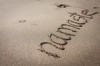 沙子上的Namaste文字