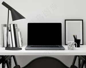 桌子上的电脑和办公用品