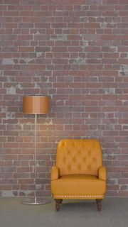 红色落地灯休闲沙发与砖墙装饰高清摄影图片