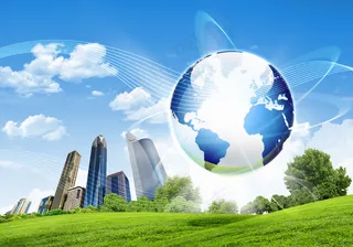 草地上的高楼和地球图片