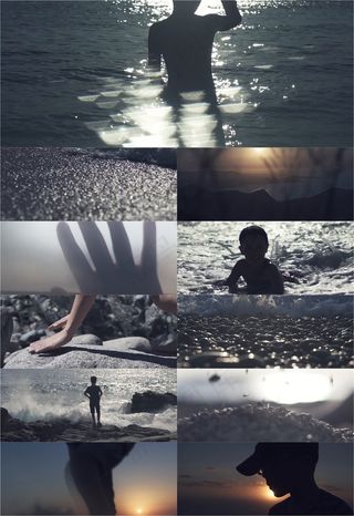 小孩在海边玩耍的背影实拍视频