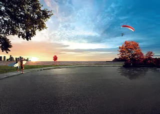 海滩跳伞夕阳图片