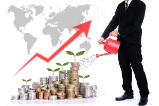 浇硬币草的商务男士图片