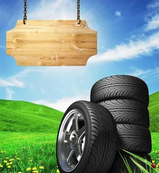 蓝天白云绿野轮胎图片