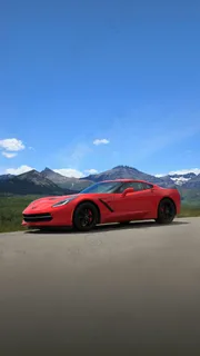 蓝天白云下的红色双人座跑车高清摄影图片