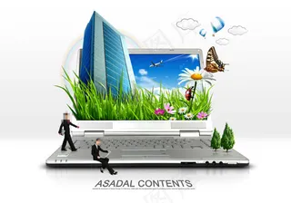 笔记本电脑上的楼房和绿草