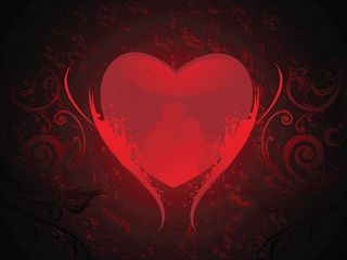 亲吻的情侣在破旧的红色的心