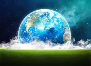 草地上的地球图片