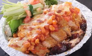 芝士焗鲜茄汁黄豆猪扒饭图片